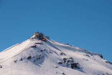 Swiss mountain peak after snowfall with panoramic view of Murren Jungfrau ski region.