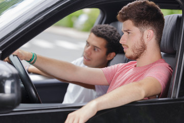 young people waiting in a car
