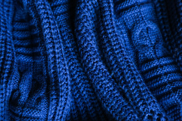  Classic blue dark knitted background. Close up texture . wrinkled and shadows, top view. 2020 trend color