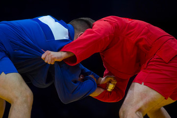 Sambo fighter attacking his opponent with leg technique