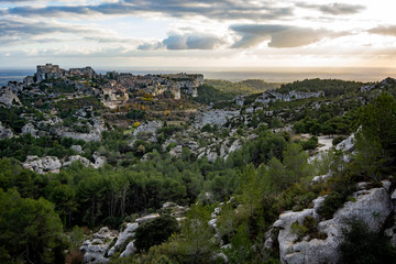 View of the Baux de Provence at sunset from a vantage point in the Alpilles at sunset, south of France.