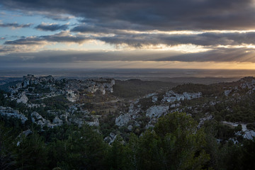 View of the Baux de Provence at sunset from a vantage point in the Alpilles at sunset, south of France.