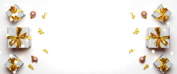 Xmas decoration. gold Christmas gifts, ornaments on white background. Winter holiday xmas present concept. Merry Christmas and Happy Holidays greeting card, frame, banner