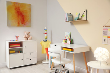 Stylish child room interior with modern furniture
