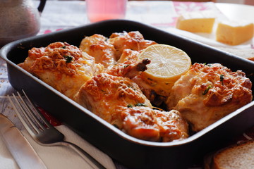 baked meat with lemon and cheese