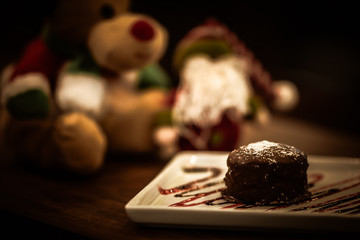 Christmas sweets in rustic cafeteria environment. Typical South American sweet known as gingerbread. Christmas decoration with chocolate candy.