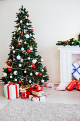 Christmas tree with Garland decoration and gifts for the new year