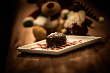 Christmas sweets in rustic cafeteria environment. Typical South American sweet known as gingerbread. Christmas decoration with chocolate candy.