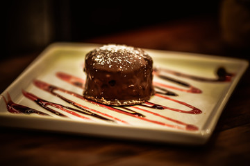 Christmas sweets in rustic cafeteria environment. Typical South American sweet known as gingerbread. Christmas decoration with chocolate candy.
