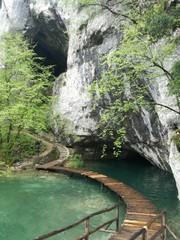 Waterfal, lake, cascades, canyon and wooden bridge in Plitvice Lakes National Park, one of the oldest and largest national parks in Croatia, ex Yugoslavia
