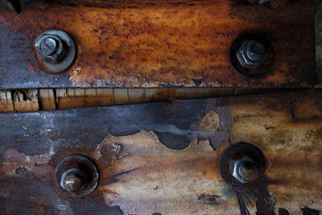 Closeup texture of rusty metal and bolts