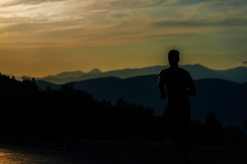 Fototapeta na wymiar Silhouette man working out while training run exercise