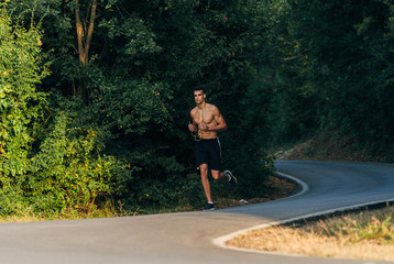 Sportive man working out with earphones