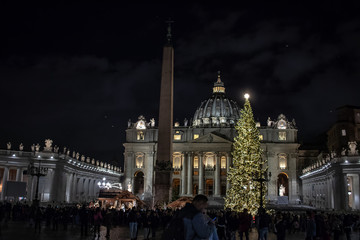 Rome Italy; 8 December 2019. In Piazza San Pietro the nativity scene reproduced with the wood of Trentino. With the Christmas tree in the background.