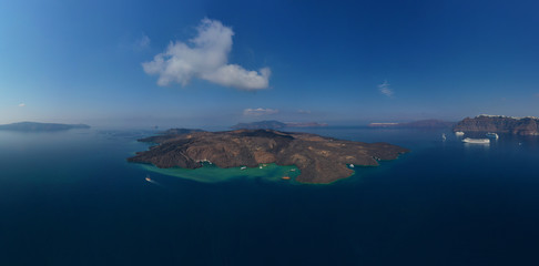 Aerial drone panoramic photo of iconic main crater of Santorini volcanic island - Kameni, Cyclades, Greece