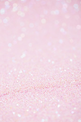 Vertical pink background with closeup light sparkling glitter texture - 309858855