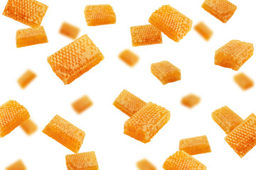 Falling Honeycomb isolated on white background, selective focus