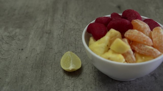 Delicious bowl with Spicy mango gummy, tangerine and pineapple 