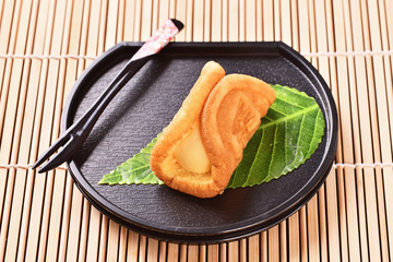 Cream waffles on black plate