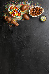 Obraz na płótnie Canvas chocolate bunnies with colorful candies