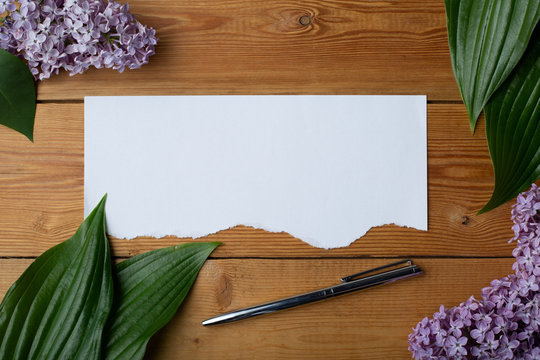 paper with flowers on a wooden background