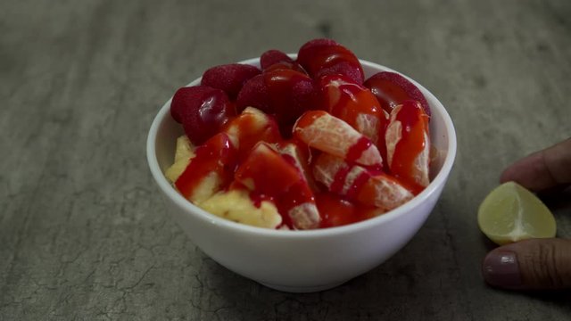 Delicious bowl with Spicy mango gummy, tangerine and pineapple