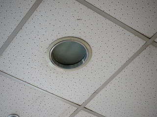Built-in lamp in the office ceiling of the office building. Close-up