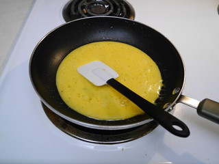 spreading an omelet