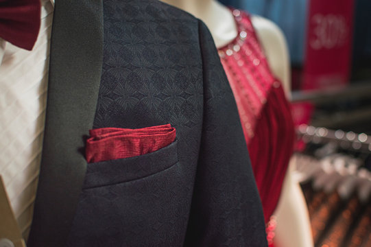 gray suit, blue west and red tie. Textured fabrics for businessmen suit. close up picture.