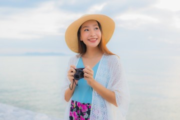 Portrait beautiful young asian women happy smile relax around sea beach ocean