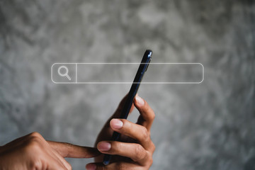 People hand using mobile phone or smartphone searching for information in internet online society web with search box icon.