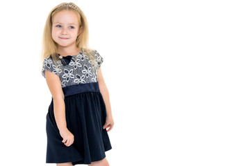 Fototapeta premium Little girl posing in studio on a white background.