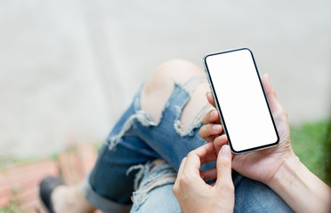 Mockup image blank white screen cell phone.man hand holding texting using mobile at outdoor.background empty space for advertise text.people contact marketing business,technology 