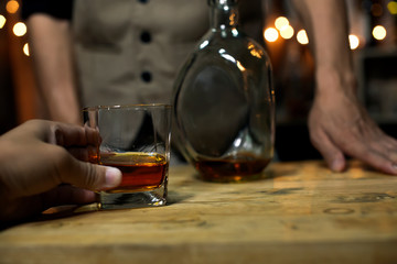Bartender Serve Whiskey, on wood bar, 