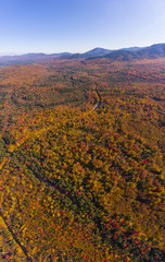 White Mountain National Forest fall foliage on Kancamagus Highway aerial view near Sugar Hill Scenic Vista, Town of Lincoln, New Hampshire NH, USA.