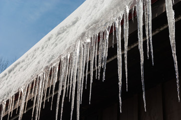 Icicles on roof in warm winter