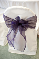 purple chair bow at wedding