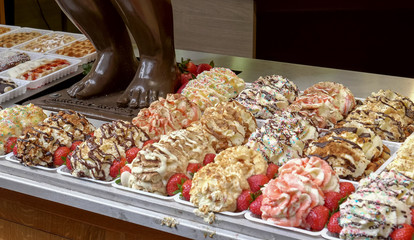 belgian waffles and the feet of a choc mannequin pis in brussels