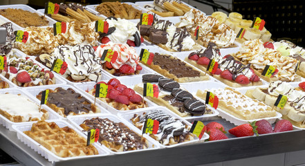 display of fresh belgian waffles small with flags in brussels