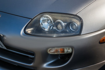 Obraz na płótnie Canvas 自動車のヘッドライト　Headlight of the car old
