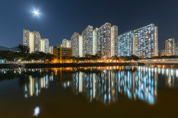 Fototapeta na wymiar High rise residential building of public estate in Hong Kong city at night