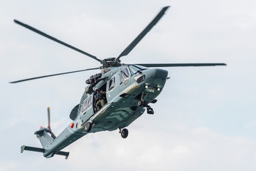 Fototapeta na wymiar Flying rescue helicopter in the sky