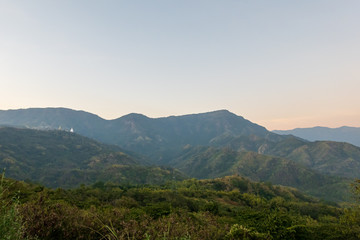 Naklejka premium Wat Pha Sorn Kaew, Wat Phra Thart Pha Sorn Kaew, is a Buddhist temple with beautiful blue sky high peak mountains mist fog wildlife green forest at Khao Koh, Phu Tub Berk, Phetchabun, Thailand
