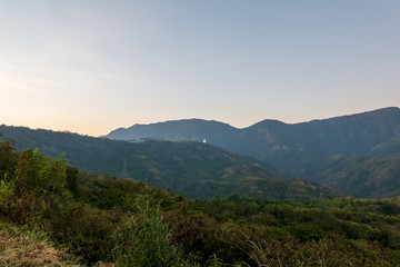 Wat Pha Sorn Kaew, Wat Phra Thart Pha Sorn Kaew, is a Buddhist temple with beautiful blue sky high peak mountains mist fog wildlife green forest at Khao Koh, Phu Tub Berk, Phetchabun, Thailand