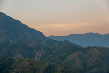 beautiful blue sky high peak mountains mist fog wildlife green forest at Khao Koh, Phu Tub Berk, Phetchabun, Thailand  guiding idea long weekend for backpacker camping campfire relaxing hiking