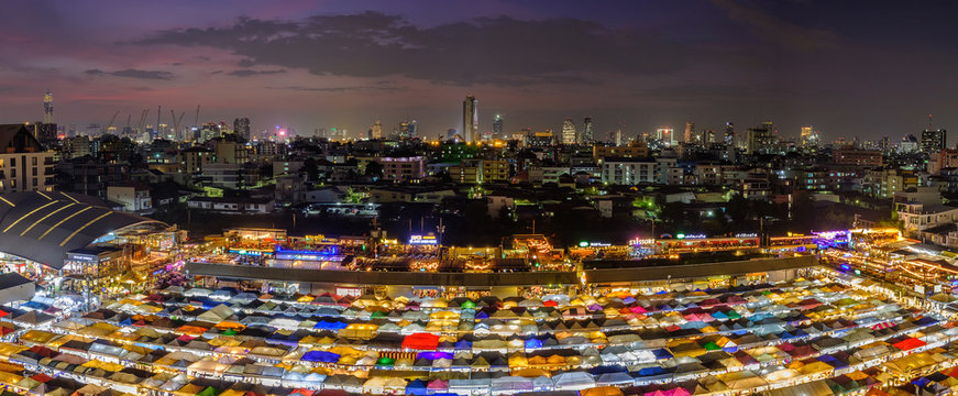 Night view of the Train Night Market Ratchada. Train Night Market Ratchada, also known as Talad Nud Rod Fai, is a new flea market place at Bangkok.
