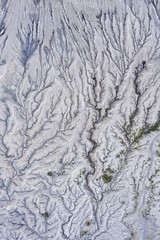 View from above, stunning aerial view of dried lava that forms a beautiful natural texture under the Mount Bromo. Cemoro Lawang, East Java, Indonesia.