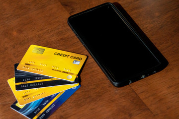 Close-up Of Business Paying With Credit Card On Mobile Phone.