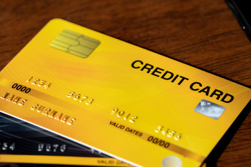 Stack of multicolored credit cards close-up on table.