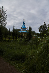 The bell tower of an Orthodox church on the island of Valaam. Nearby is the Christian Cathedral. Russia, Karelia.The bell tower of an Orthodox church